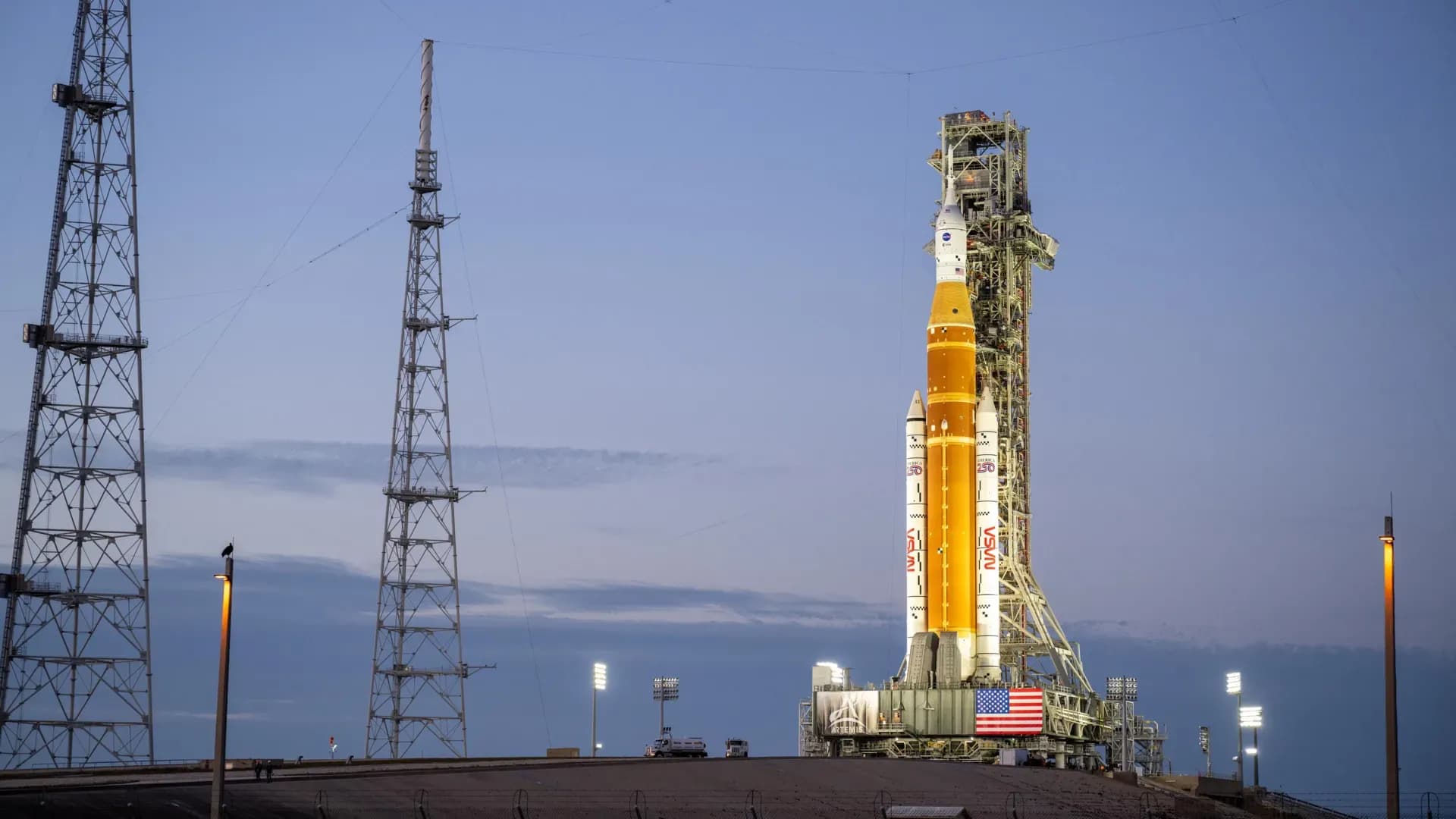Artemis II SLS rocket and Orion spacecraft illuminated at Launch Pad 39B during nighttime prelaunch preparations at NASA’s Kennedy Space Center.