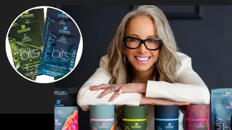 EnergyBits founder Catharine Arnston smiling with product packaging, highlighting RecoveryBits and EnergyBits algae tablets