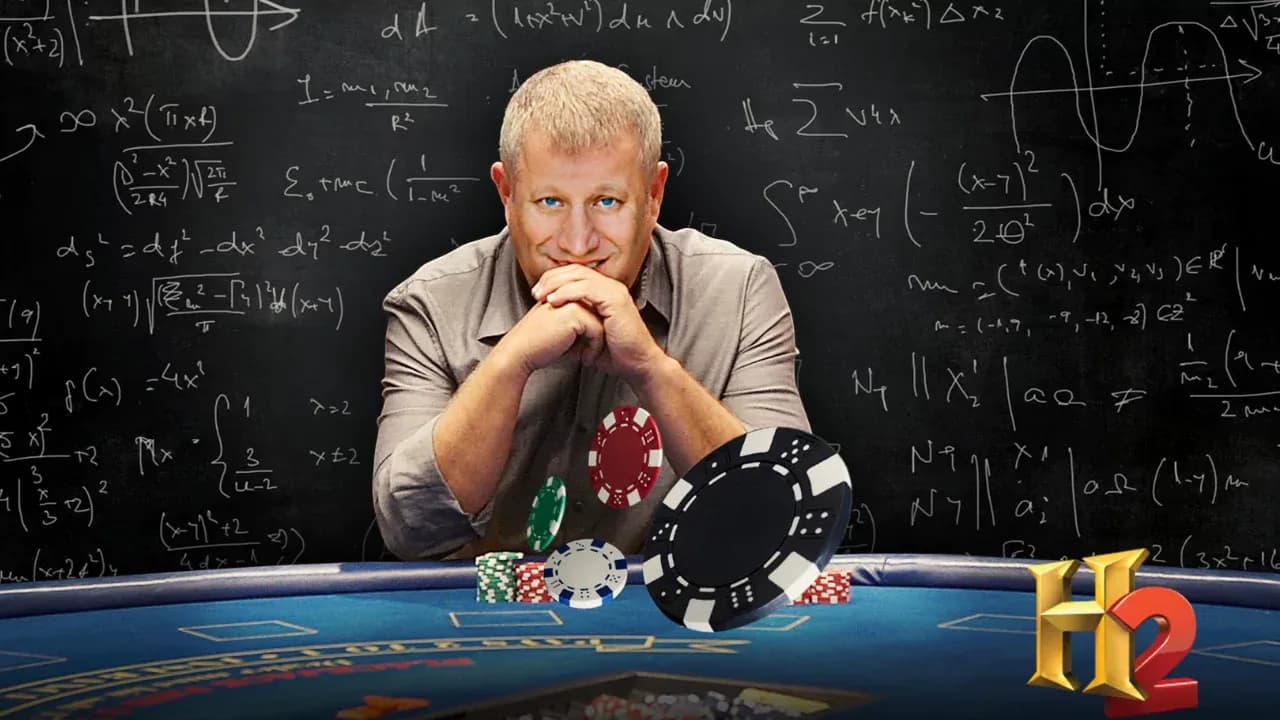 Scott Flansburg, the fastest human calculator, sitting at a poker table with math equations on a chalkboard behind him