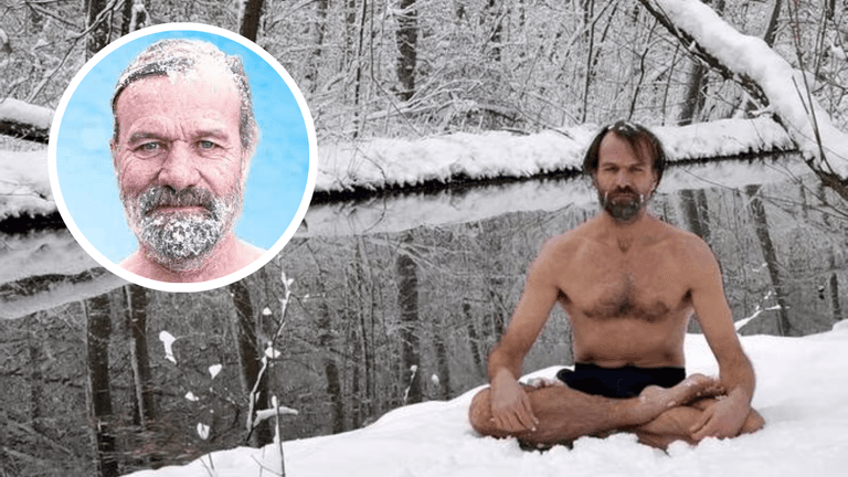 Wim Hof, known as The Iceman, sits shirtless in a snowy forest practicing deep breathing meditation beside an icy river.