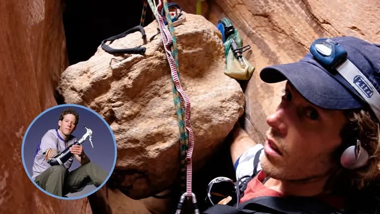 Aron Ralston trapped beside a boulder in a narrow canyon, with an inset portrait showing his climbing prosthesis