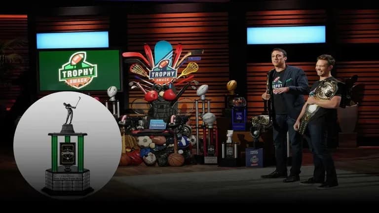 Trophy Smack founders pitching custom fantasy sports trophies on Shark Tank with championship belts and sports-themed props
