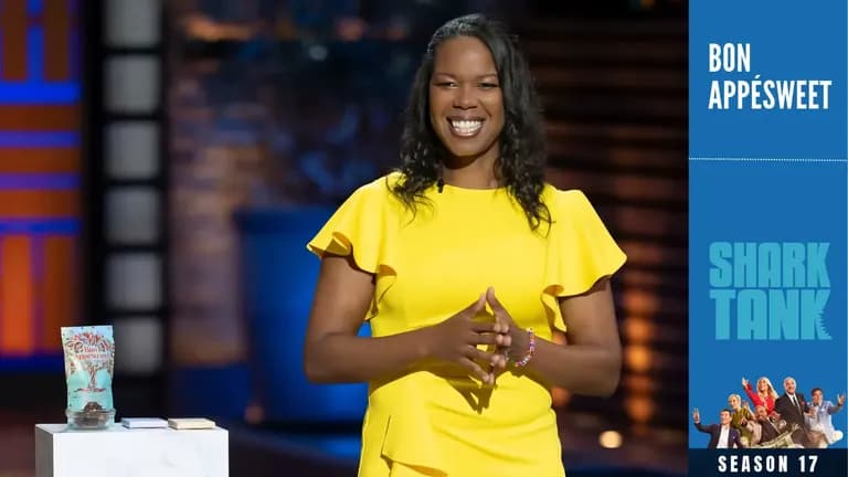 Thereasa Black in a yellow dress presenting Bon AppéSweet chocolate on Shark Tank Season 17.