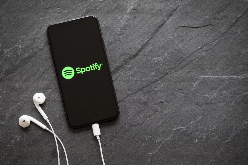 spotify on a phone with headphones
