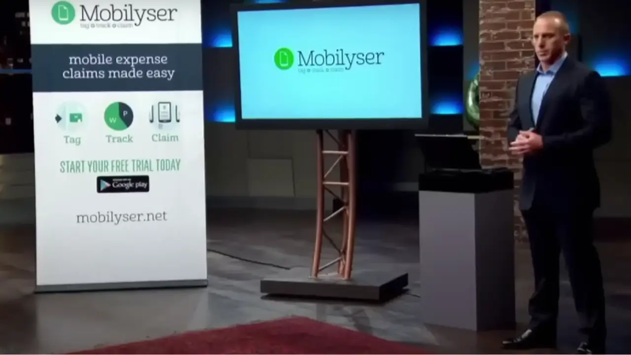Robbie Adams presenting Mobilyser on Shark Tank Australia with product banner and app demo screen