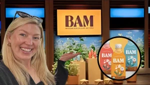 Paige Hansen presenting BAM Buckwheat Milk on Shark Tank with product lineup and BAM logo in the background.