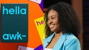 Brittane Rowe presenting Hella Awkward card game on Shark Tank with product box and colorful question cards