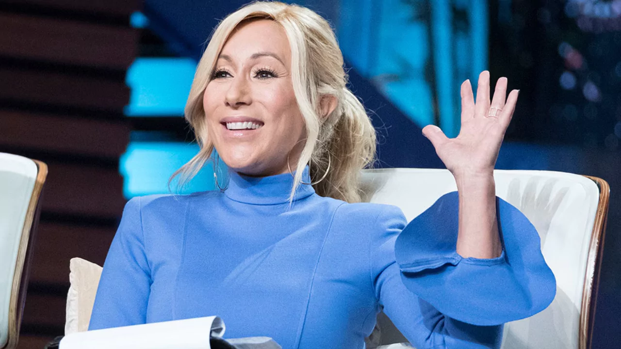 Lori Greiner smiling and waving during a Shark Tank episode, reflecting on her investment journey ahead of Season 17.