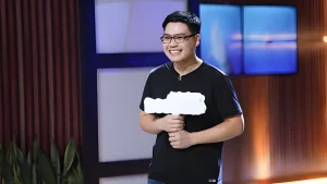 Coolmate founder presents pitch on Shark Tank Vietnam, holding a white product cutout during his record-fast deal.