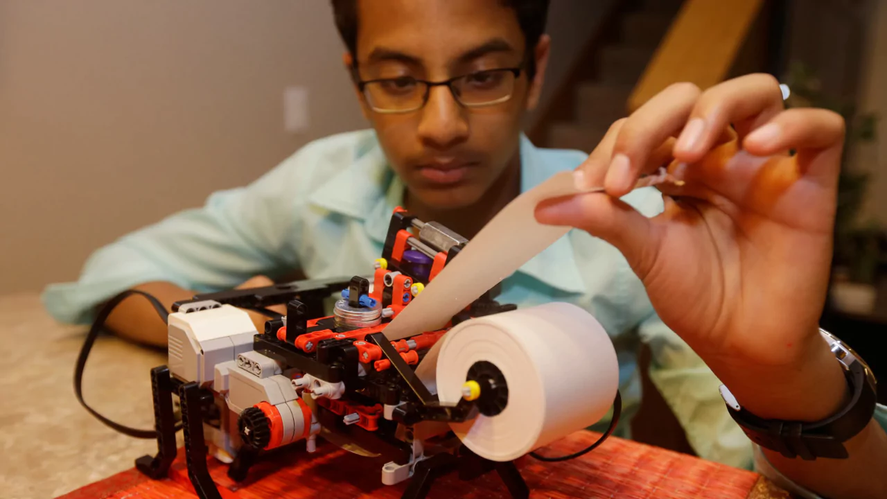 13-year-old inventor Shubham Banerjee using his LEGO Mindstorms Braille printer to create affordable text for blind readers