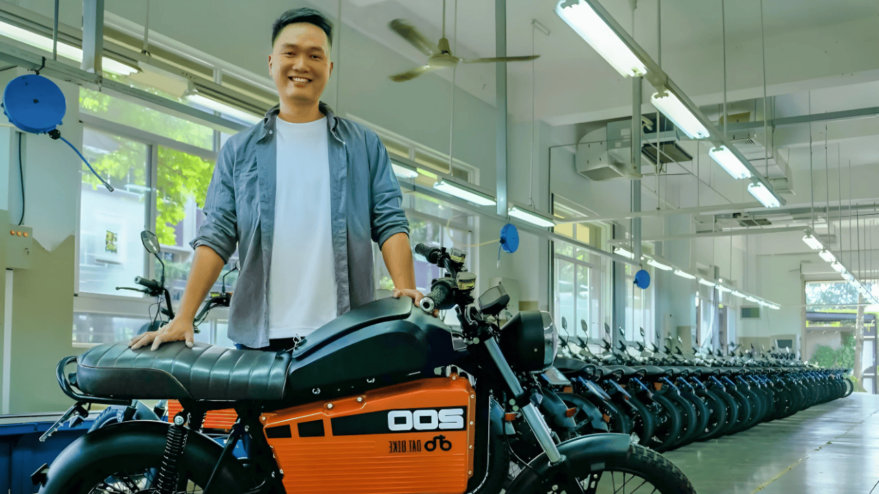 Nguyen Ba Canh Son, founder of Dat Bike, standing with an electric motorbike inside the company’s factory in Vietnam 2025