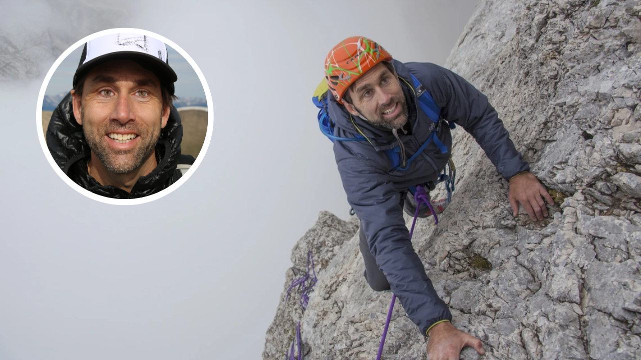 Blind adventurer Erik Weihenmayer climbing a steep rock face with ropes and helmet, inset portrait of him smiling