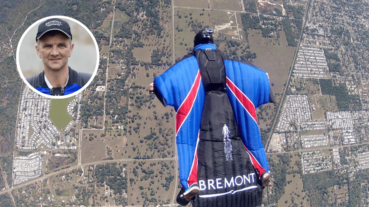 Gary Connery flying in a wingsuit over Oxfordshire before his historic parachute-free landing on 18,600 cardboard boxes