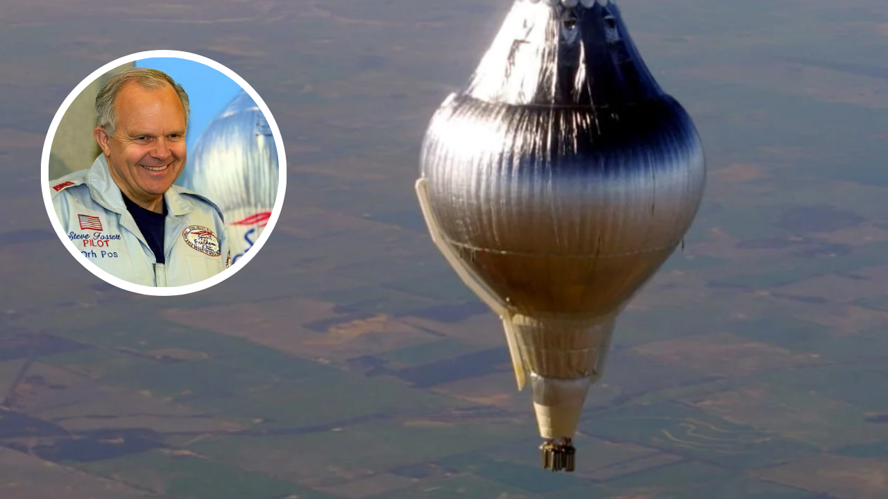 Steve Fossett smiling in his pilot suit with the Spirit of Freedom balloon soaring high during his record-breaking solo nonstop flight around the world
