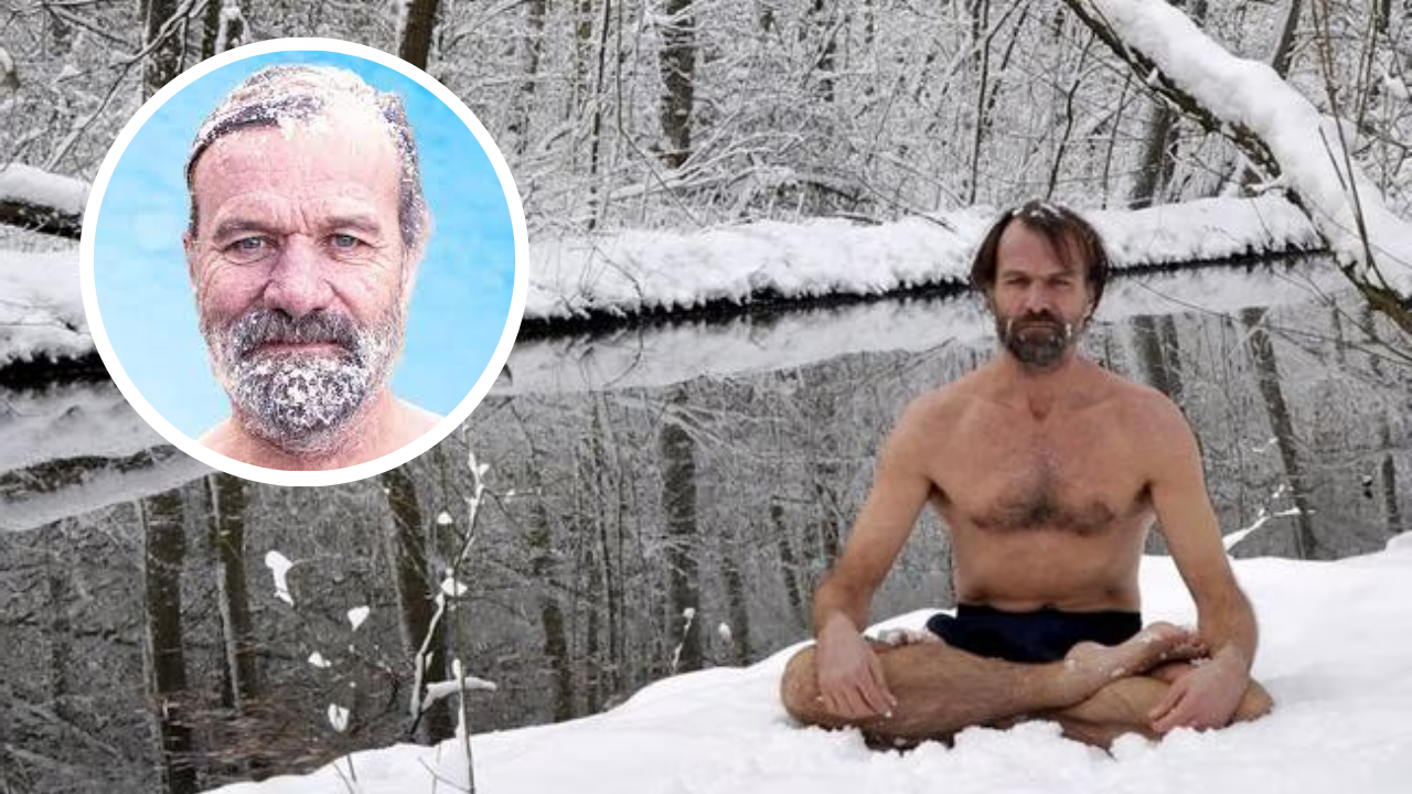 Wim Hof, known as The Iceman, sits shirtless in a snowy forest practicing deep breathing meditation beside an icy river.